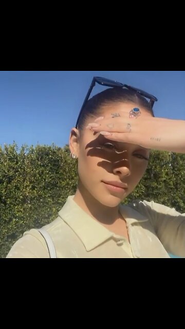 Ariana grande with glasses in sunlight