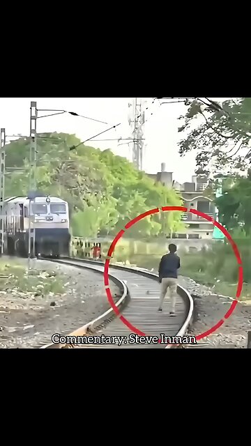Unhinged man tries to block a train and gets smacked
