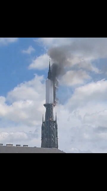 Spire Of Famous French Cathedral On Fire
