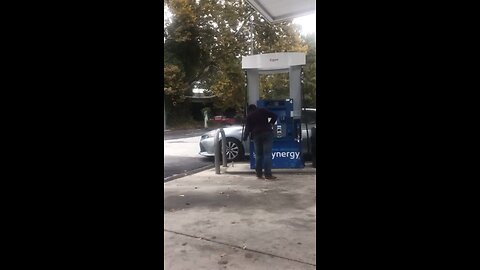 Lady trying to drink diesel at gas station