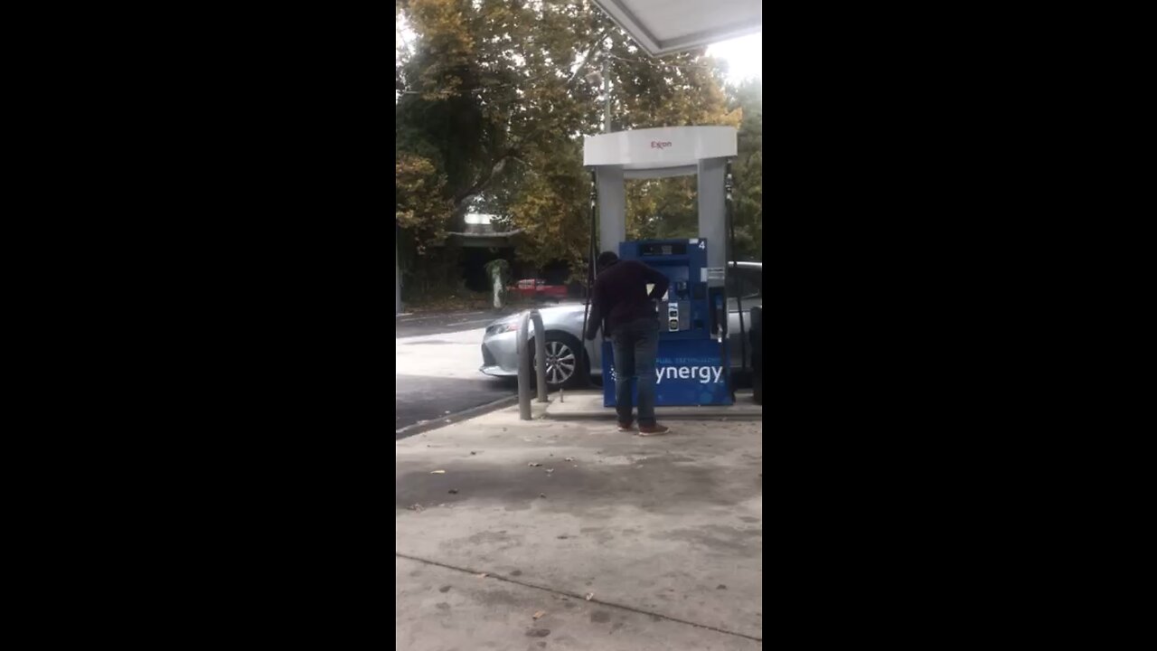 Lady trying to drink diesel at gas station