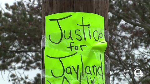 Viral video shows Akron officers removing Jayland Walker poster