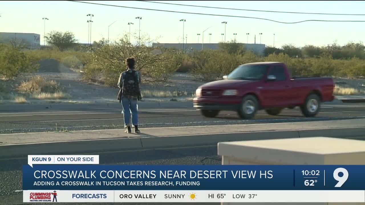 As students dodge traffic, a crosswalk is several steps away