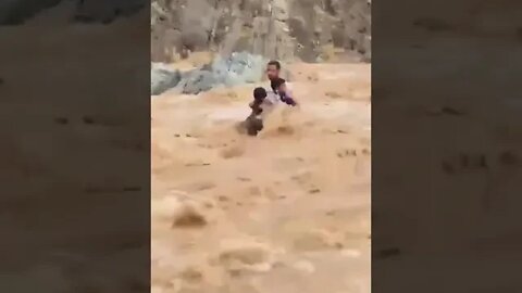 Man saves children from drowning in severe flooding.