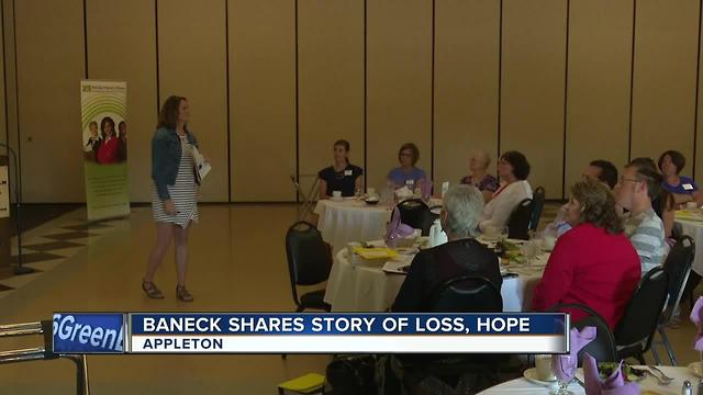 A woman who lost her family members in a fire speaks to a women's group in Appleton