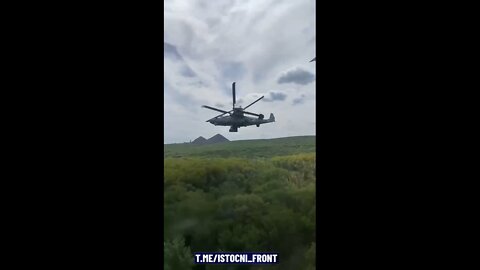 Beautiful shot of a low-flying Ka-52 filmed from the air