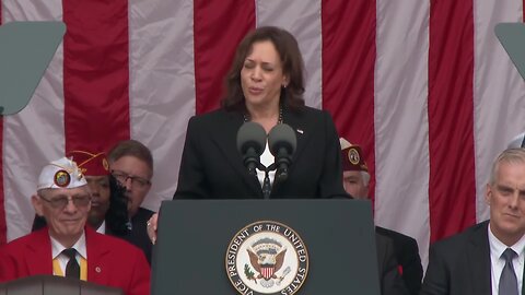 Joe Biden trips over something black + Kamala Harris calls him one of the "Greatest Champions"