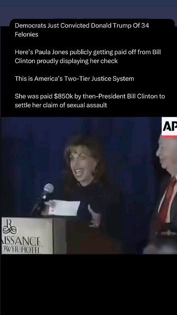 Paula Jones excepting a check in public from bill Clinton for sexual abuse while president
