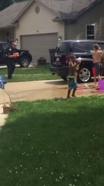 Police Officers Take Part In Good Old Super Soaker Fight