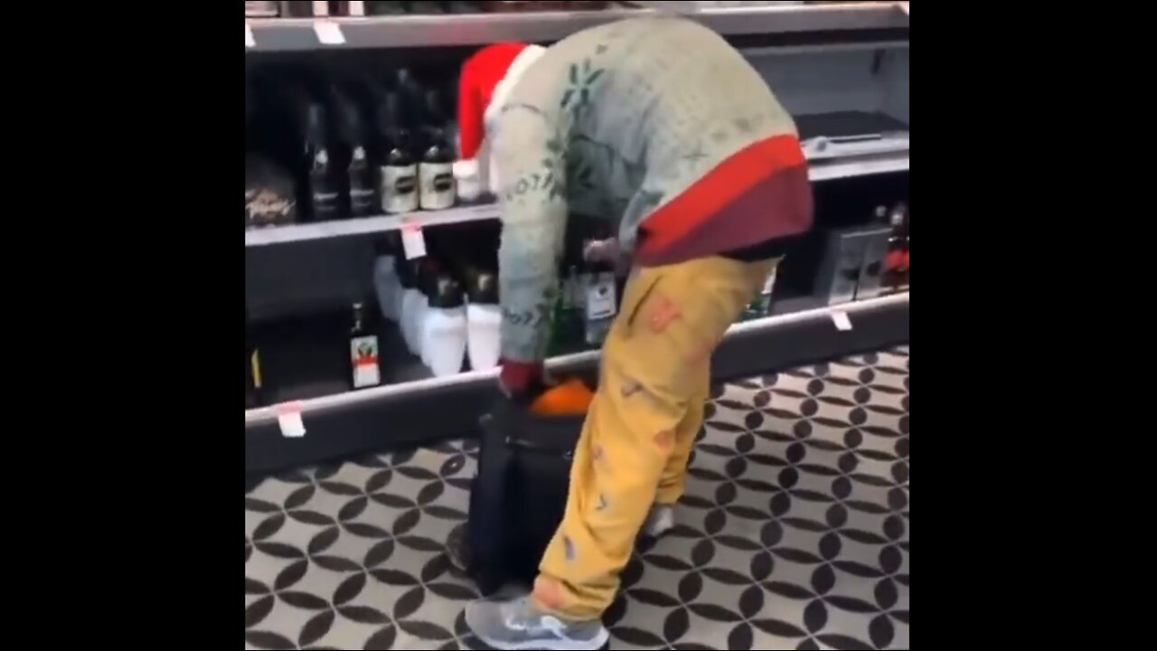 Ugly Sweater Shoplifter Stocks Up On Vodka For The Christmas Weekend