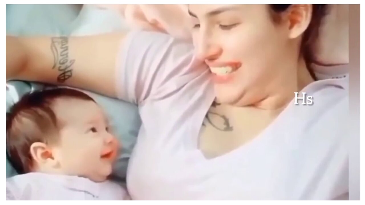 adorably baby smiling with her mom