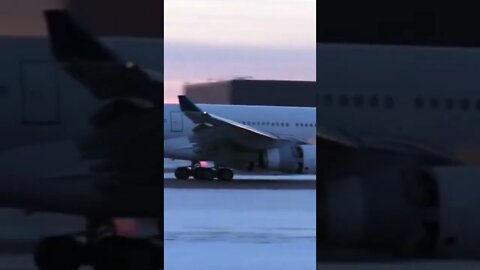 Big plane landing in ice covered Run way