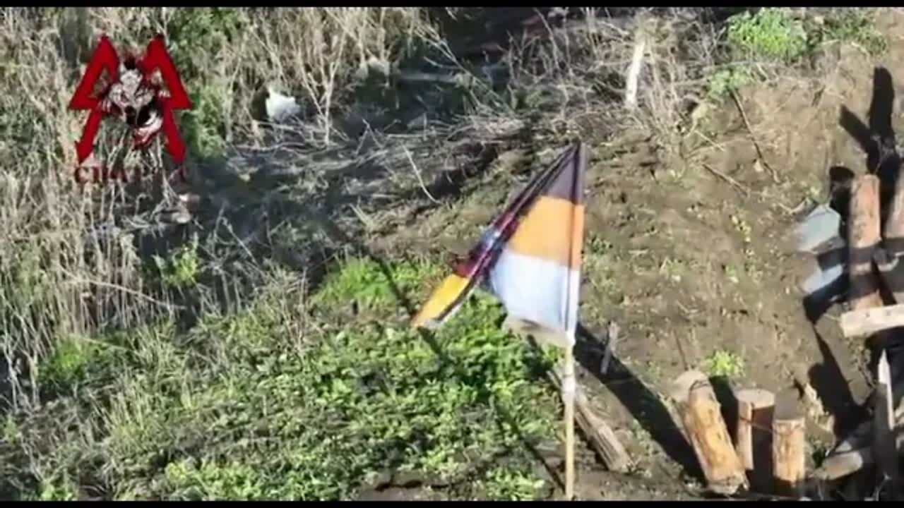 Soldiers of the DPR Sparta battalion raised their flag atop a former Ukrainian strong point