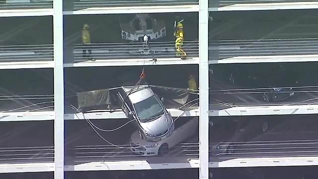 Car dangles from Santa Monica parking garage