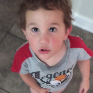 A Cute Boy Thrilled To Have A Younger Brother