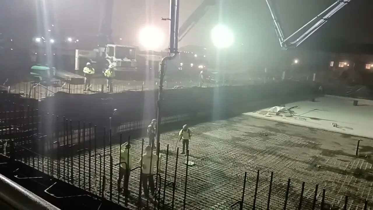 pouring a concrete slab early in the morning