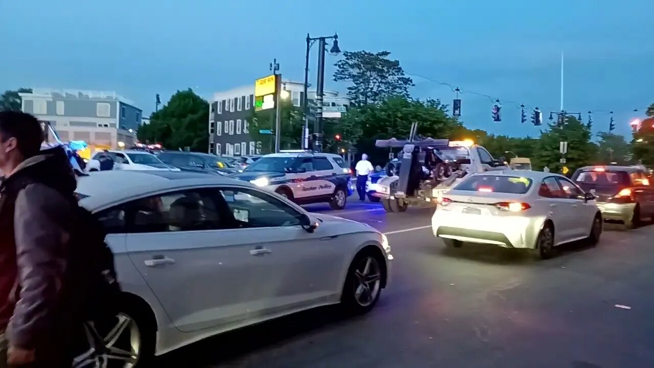 Boston police fire and EMS respond to a car versus a tow truck