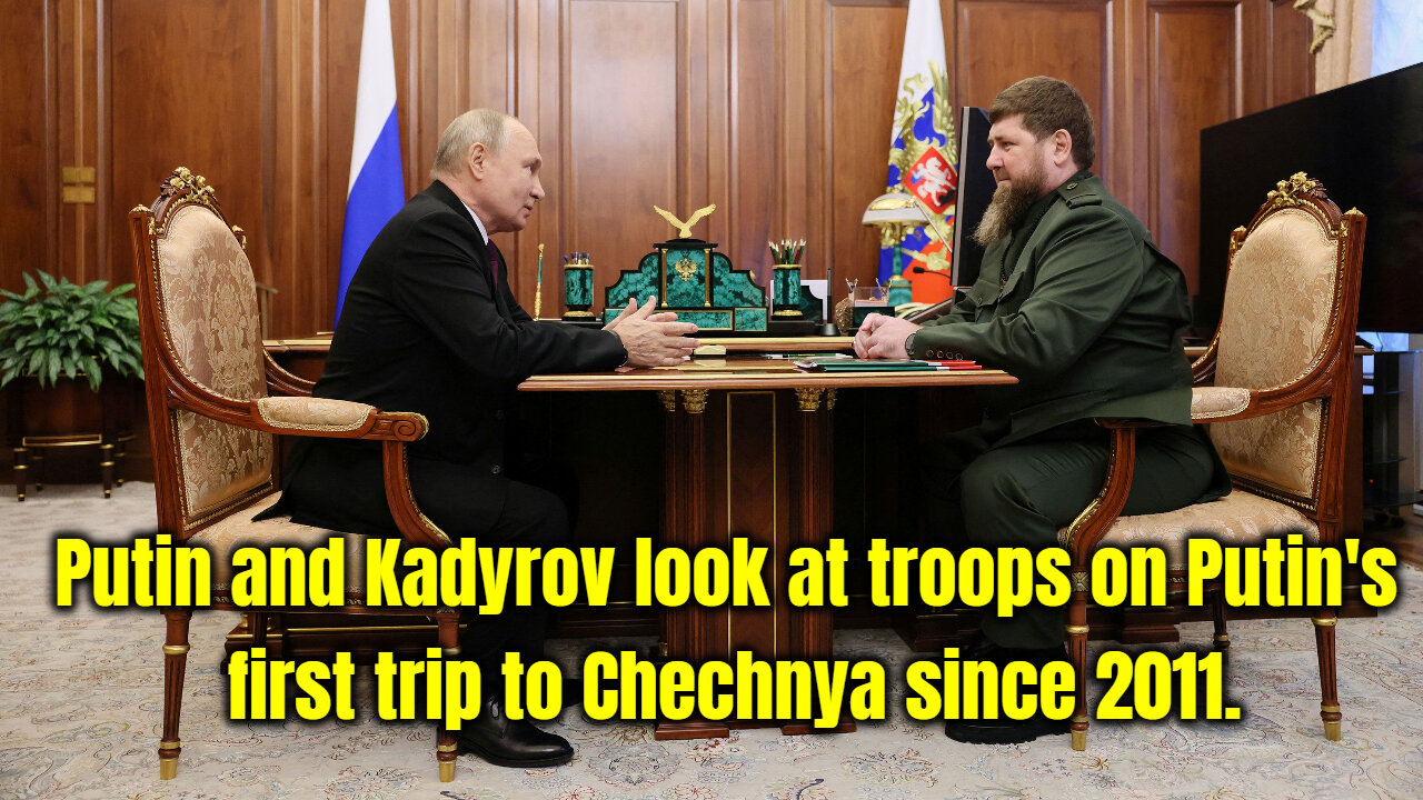 Putin and Kadyrov look at troops on Putin's first trip to Chechnya since 2011.