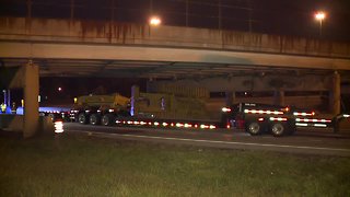 Semi hauling a bulldozer crashes into East Avenue bridge