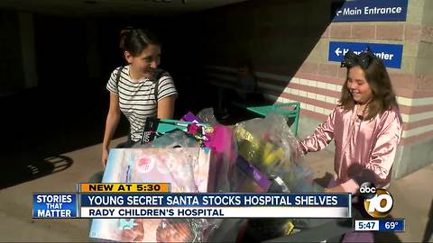 Young Secret Santa stocks hospital shelves