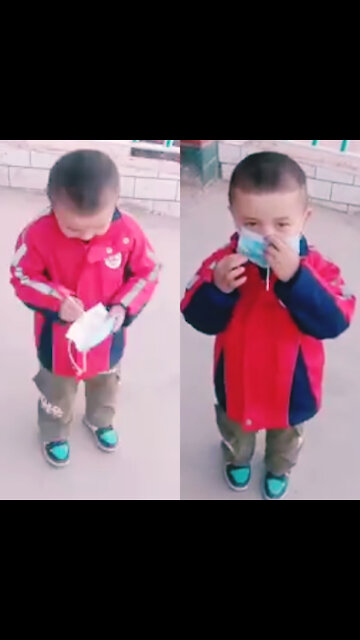 Funny The Chinese child wears a mask