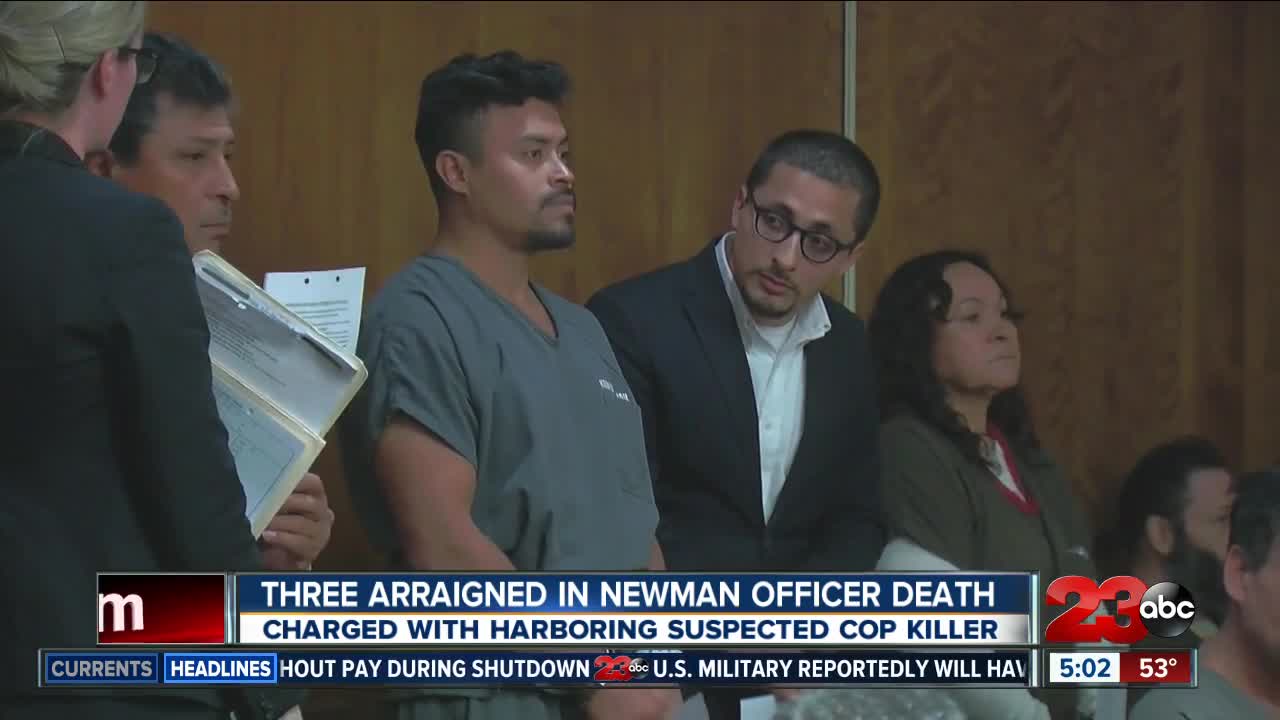 Three arraigned today for harboring suspected cop killer