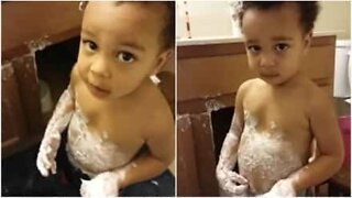 Little boy covers himself in hair cream