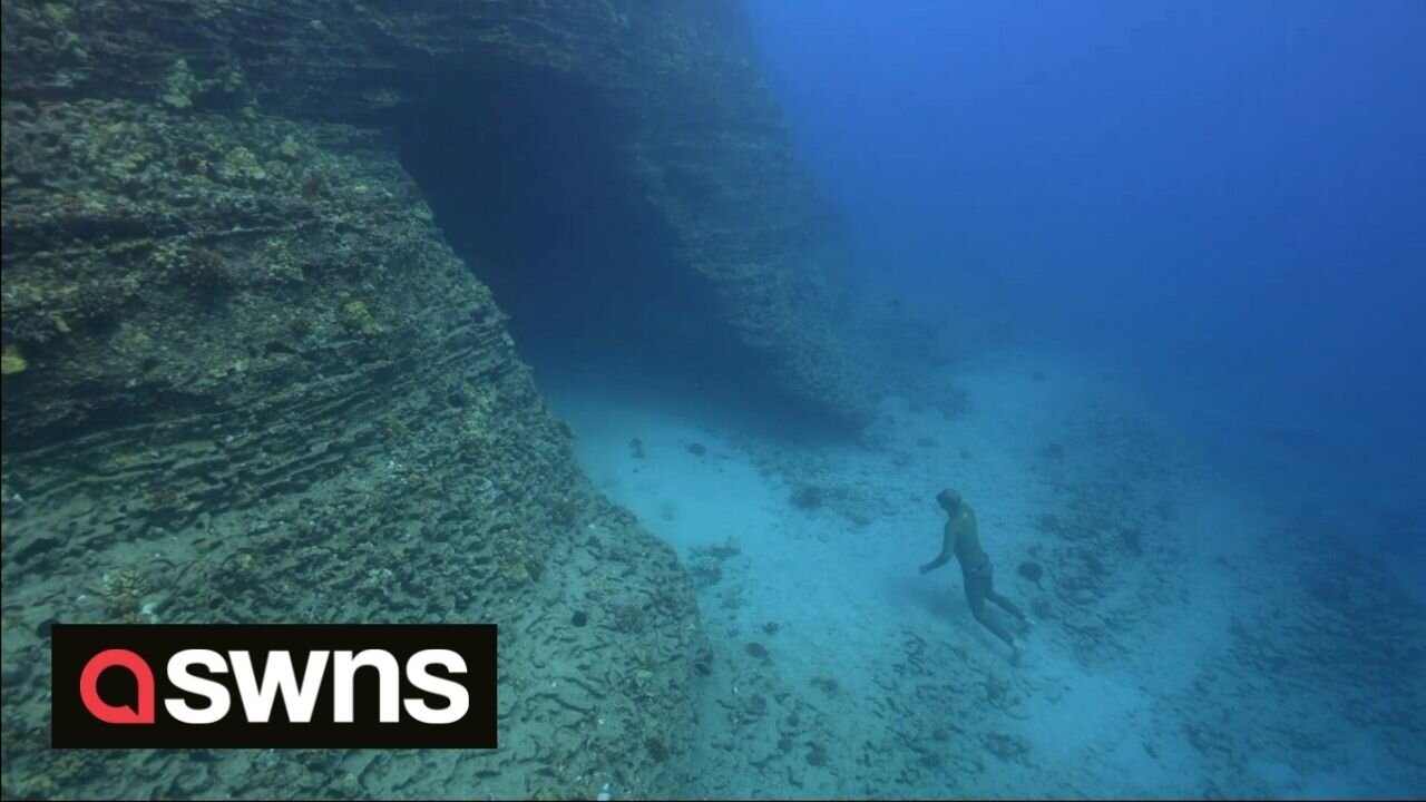 Freediver explores the infamous shipwrecks and underwater caves of Hawaii