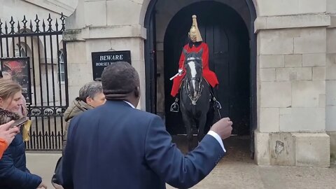 Man sings and dances in front of the kings guard he tries to stop him self from laughing #london