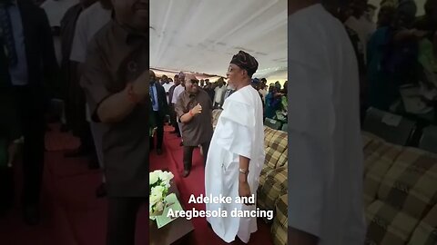 Adeleke and Aregbesola dancing at Ilesha