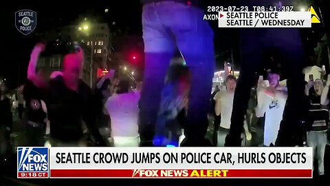 People Jump On Police Cars In Democrat-Run Seattle After Police Attempted To Disperse Unruly Crowd