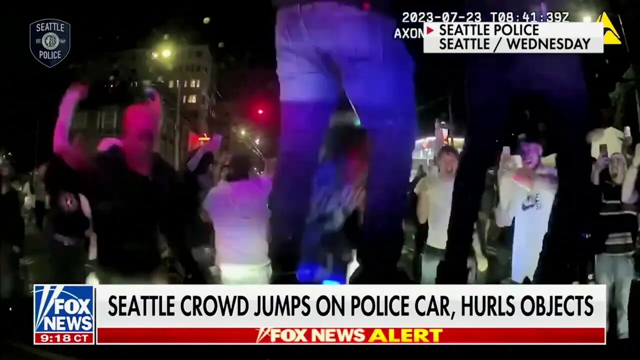 People Jump On Police Cars In Democrat-Run Seattle After Police Attempted To Disperse Unruly Crowd