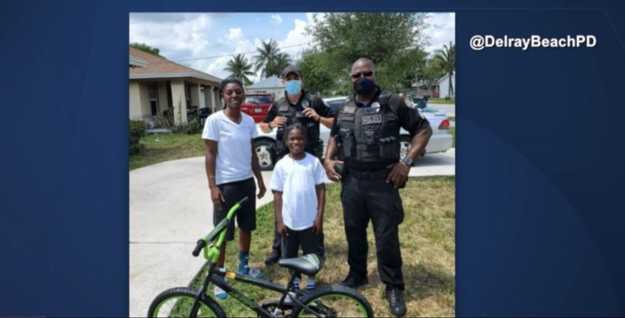 Officers give 15 students new bicycles