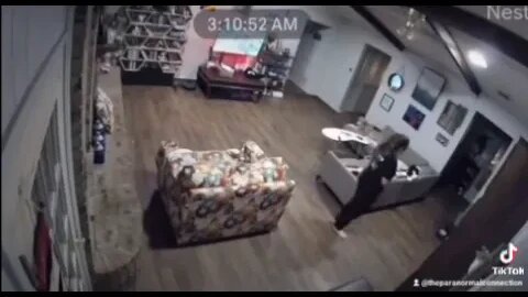 Women's hair pulled by something.