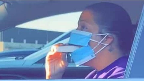 Woman finds a way to eat while wearing mask