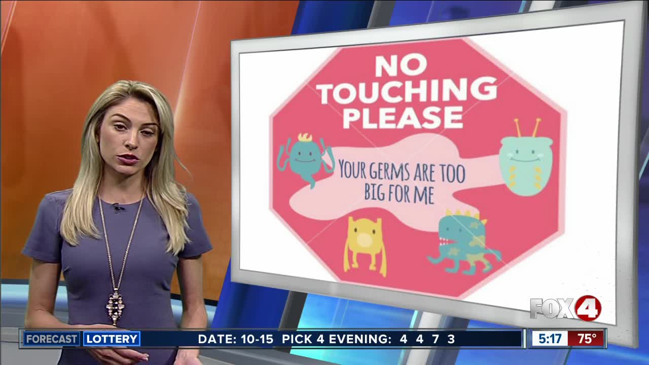 Look, don’t touch: Parents buy signs to protect infants during flu season