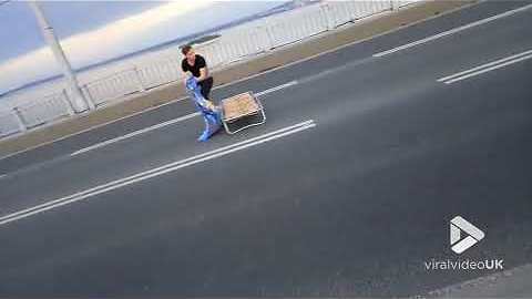Man takes a nap in the middle of the road