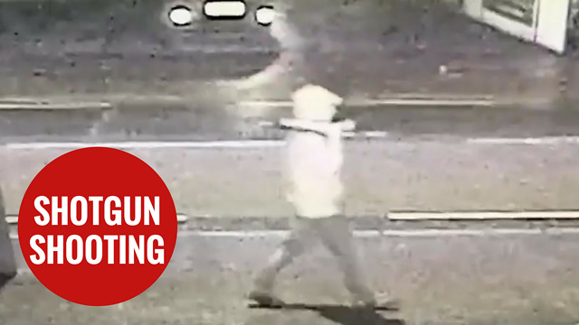 Man walking down a street holding a 'SHOTGUN,' moments before he was shot dead