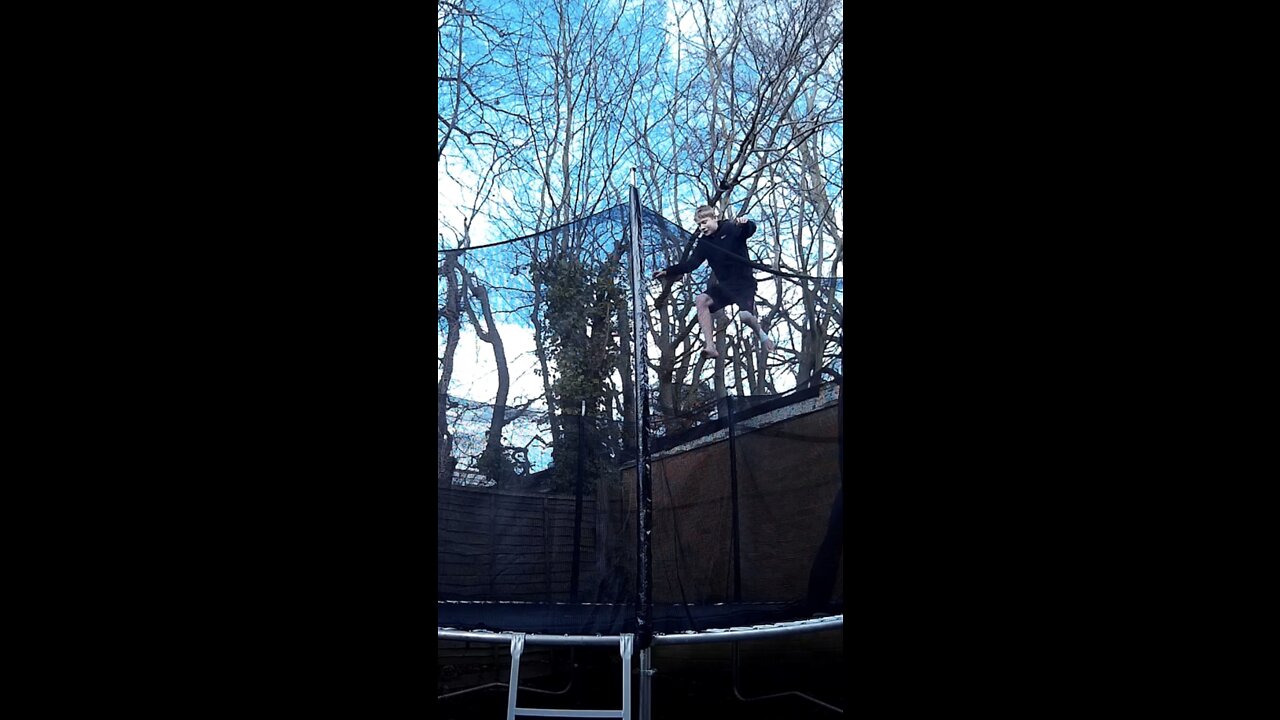 Kid Jumps Off Roof Onto Trampoline