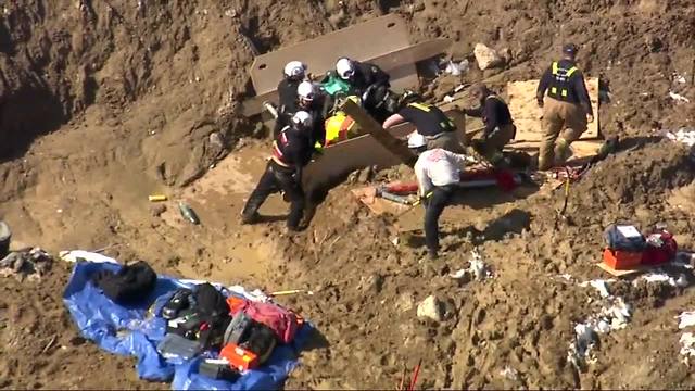 Crews rescue man stuck in waist-deep mud