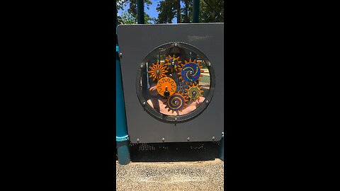 Turning gears and watching the spinning at a castle playground in Kingwood, Texas