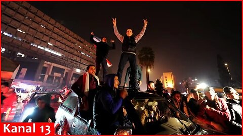 Hama residents and Syrian opposition fighters celebrate their victory after retaking the city