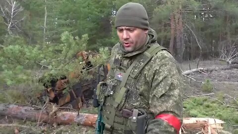 LPR soldier shows a destroyed Ukrainian T-64 and a military truck near Severodonetsk