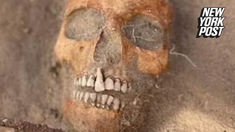 'Vampire child' corpse is discovered in Polish cemetery with triangular padlock attached to it