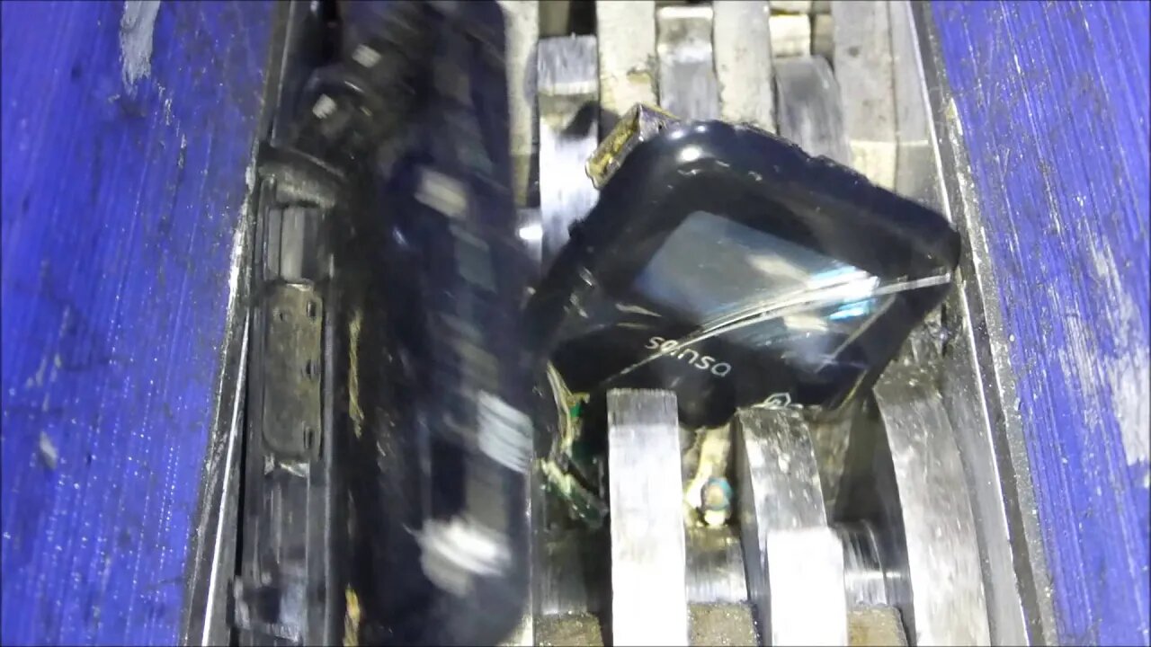 Shredding some old damaged MP3 players.