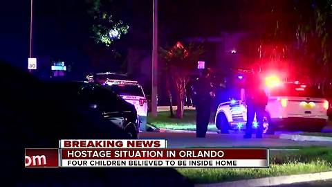 Hostage standoff with 4 children nears 24-hour mark, Orlando officer shot still critical