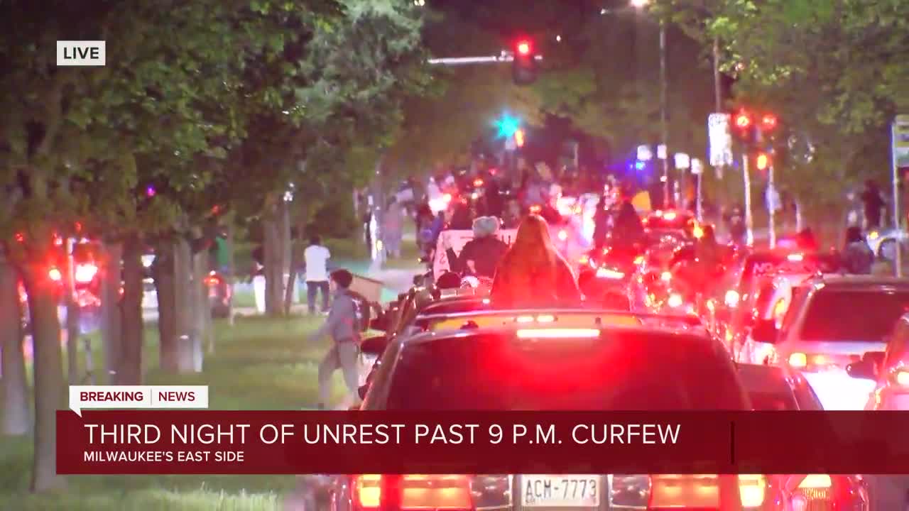 Protesters drive west occupying all four lanes of traffic on Kenwood in Milwaukee