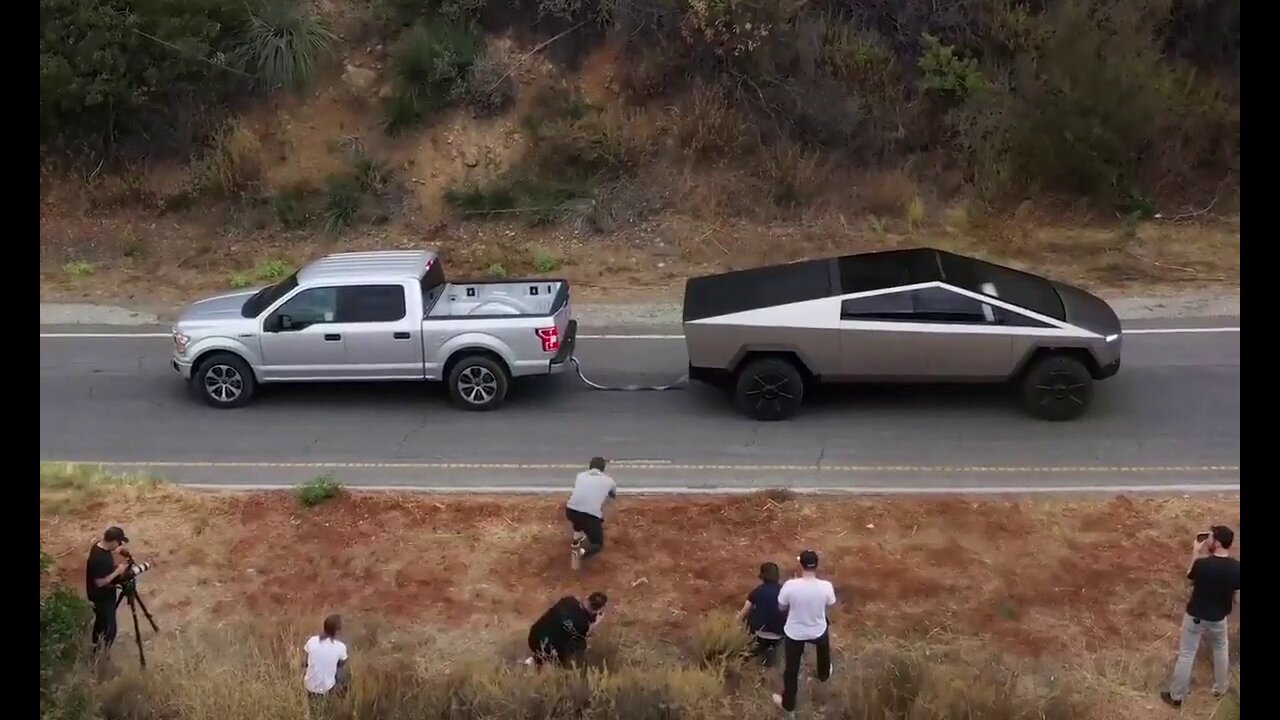 Cyber Truck Pulls F-150 up hill in one minute