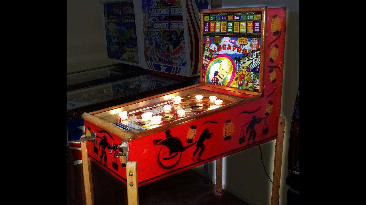 Playing a restored 1947 United Singapore Pinball machine