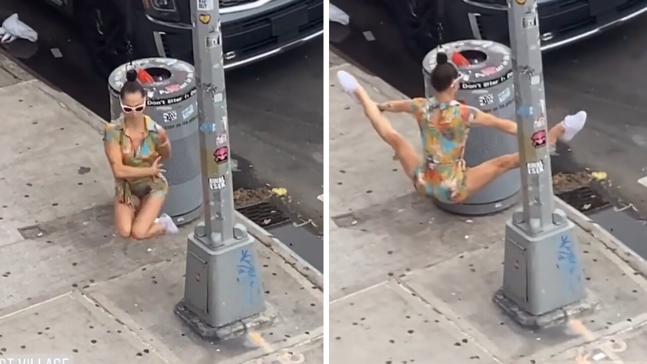 Human ornament hangs from street light in NYC